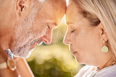 Buy stock photo Senior, couple, love and trust while together in retirement for love, care and trust on a summer vacation outdoor. Face of a man and woman touching forehead while in nature with support in marriage