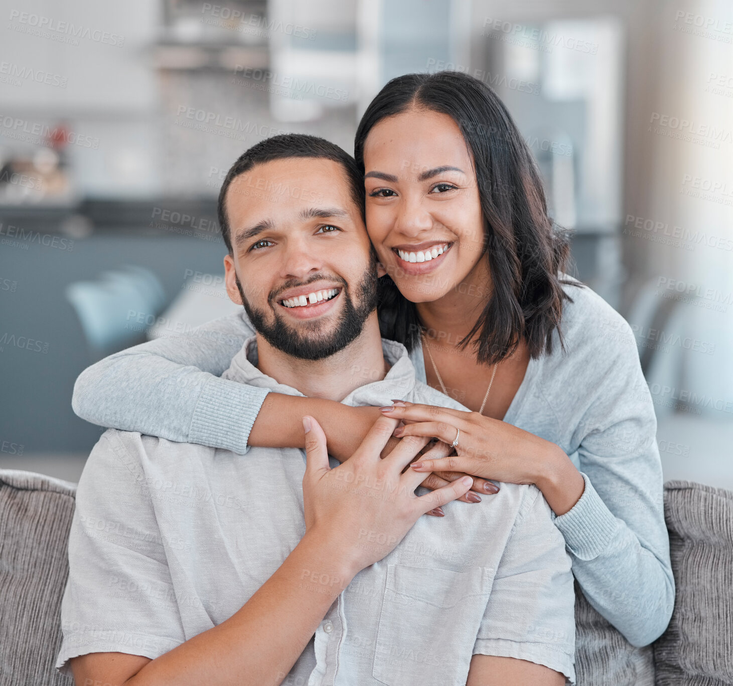 Buy stock photo Couple, hug and portrait of a man and woman embracing for love, care and affection at home. Husband, wife and caring, romantic relationship while hugging with happiness on the living room sofa