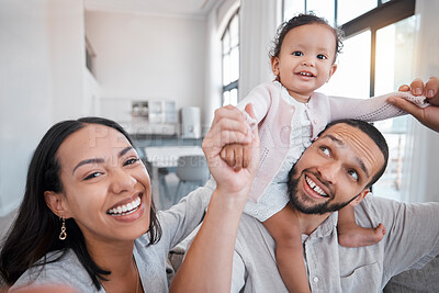 Buy stock photo Family, portrait and playing with a mother, father and baby girl being playful and cheerful in the family home. Fun, funny and man and woman loving, caring and carrying little girl for comic bonding