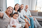 Big family, selfie and happy baby, parents and grandparents together on living room couch for bonding, love and care. Portrait of men, women and child together in their Puerto Rico house with a smile