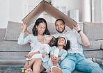 Family, children and insurance with a mother, father and daughter siblings in a living room of their home together. Security, safety and homeowner with parents holding cardboard to cover sister kids