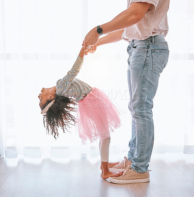 Buy stock photo Happy, bonding and father teaching child to dance on feet with support holding hands in their house. Help, ballerina and dancing girl learning a move with her dad in the living room of family home