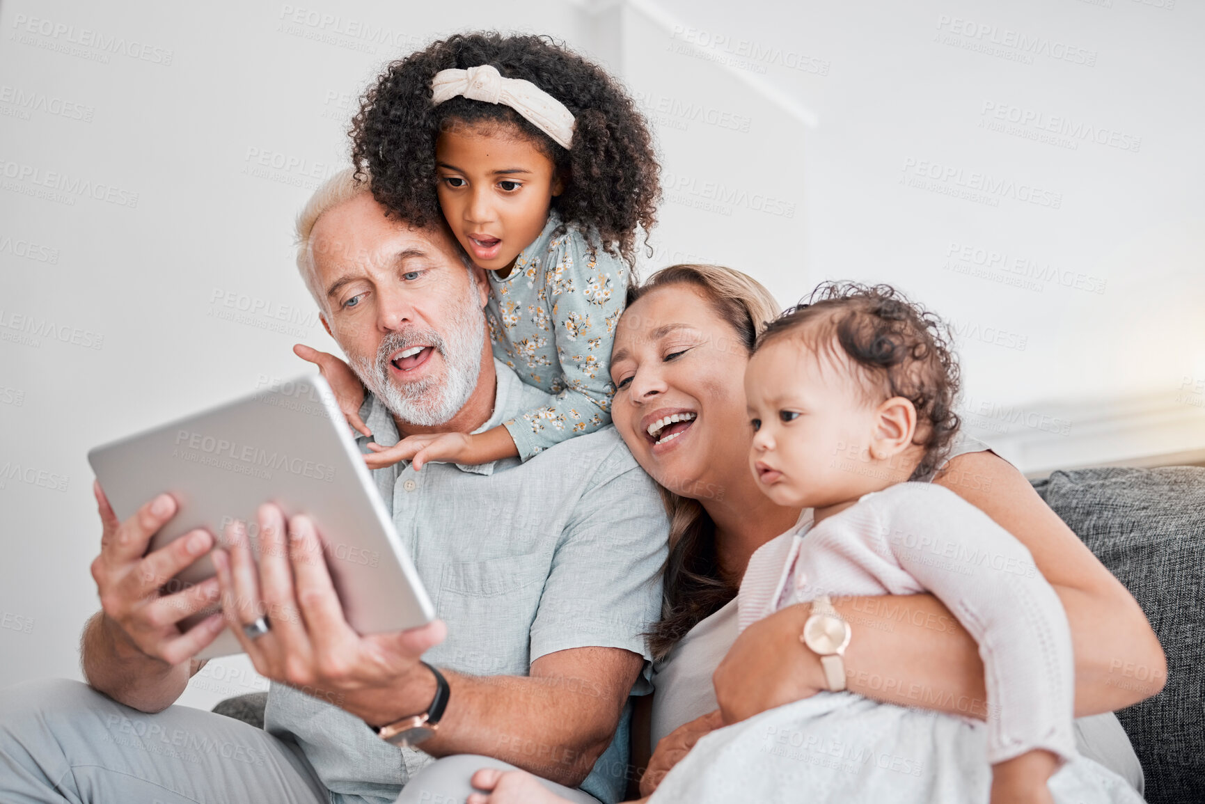 Buy stock photo Family selfie, tablet and social media, picture and happy smile with grandparents and girl children on sofa in home. Senior man, woman and kids funny face, fun and enjoying bonding in family home