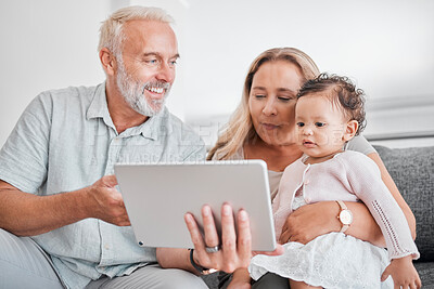 Buy stock photo Family, tablet and baby with grandparents on sofa in home on social media, streaming movie or educational app. Relax, love and grandpa, grandma and infant or child with touchscreen tech for cartoons.