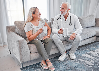 Buy stock photo Home visit, doctor and woman on sofa talking and drinking coffee in living room after consulting. Healthcare, medicine and a medical professional man and lady on couch in house or apartment with tea.