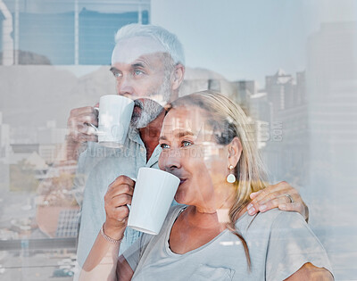 Buy stock photo Elderly couple, hug and drinking coffee by window of the city with a vision for morning routine at home. Senior man and woman relaxing looking out glass at urban town view together with warm mug