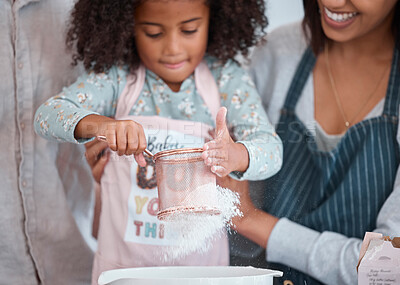 Buy stock photo Hands, children and baking with a girl learning how to bake in the kitchen of her home with mother. Flour, kids and cooking with a female child and parent teaching about ingredients for a recipe