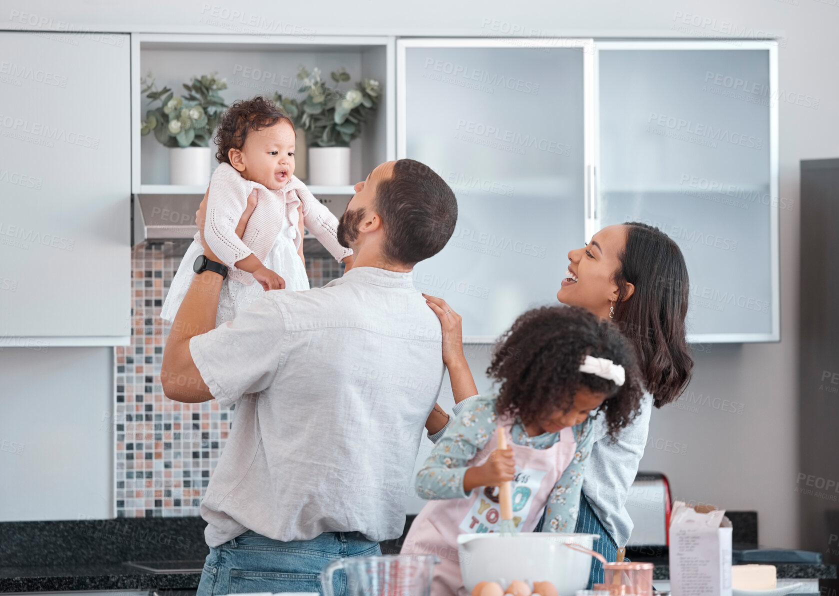 Buy stock photo Family, children and baking with a father, mother and daughter siblings in the kitchen learning to bake. Food, cooking and love with a man, woman and girl children having fun at home together