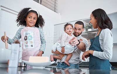 Buy stock photo Kitchen cooking, pointing and family of happy parents, baby and children learning to bake food, bonding and having fun. Black family love, child development and mother and father teaching kids baking