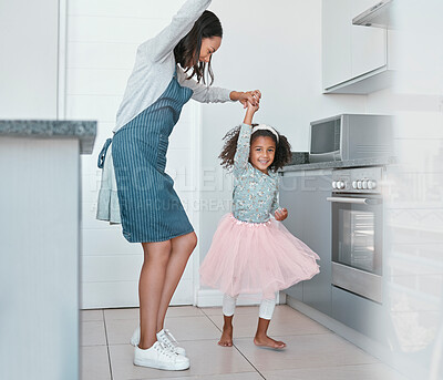 Buy stock photo Dancing, playful and mother and child with freedom, music and happy in the kitchen of their house. Crazy, comic and girl dancer teaching her mom to dance with love and smile in their family home