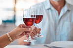 Hands, wine glasses and cheers for celebration dinner, date or table in thanks for fine dining at home. Hand of couple toasting with wine for relationship, romance and clinking glass for dating love
