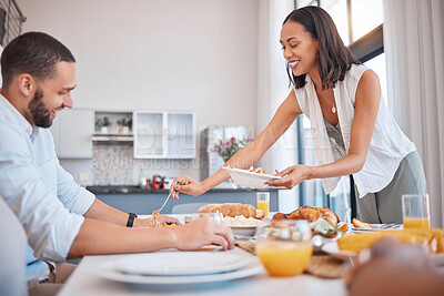 Buy stock photo Lunch, family and eating food for a party, celebration and event in a house. Breakfast, chicken and woman dishing at a dining room table during breakfast with people in a family home