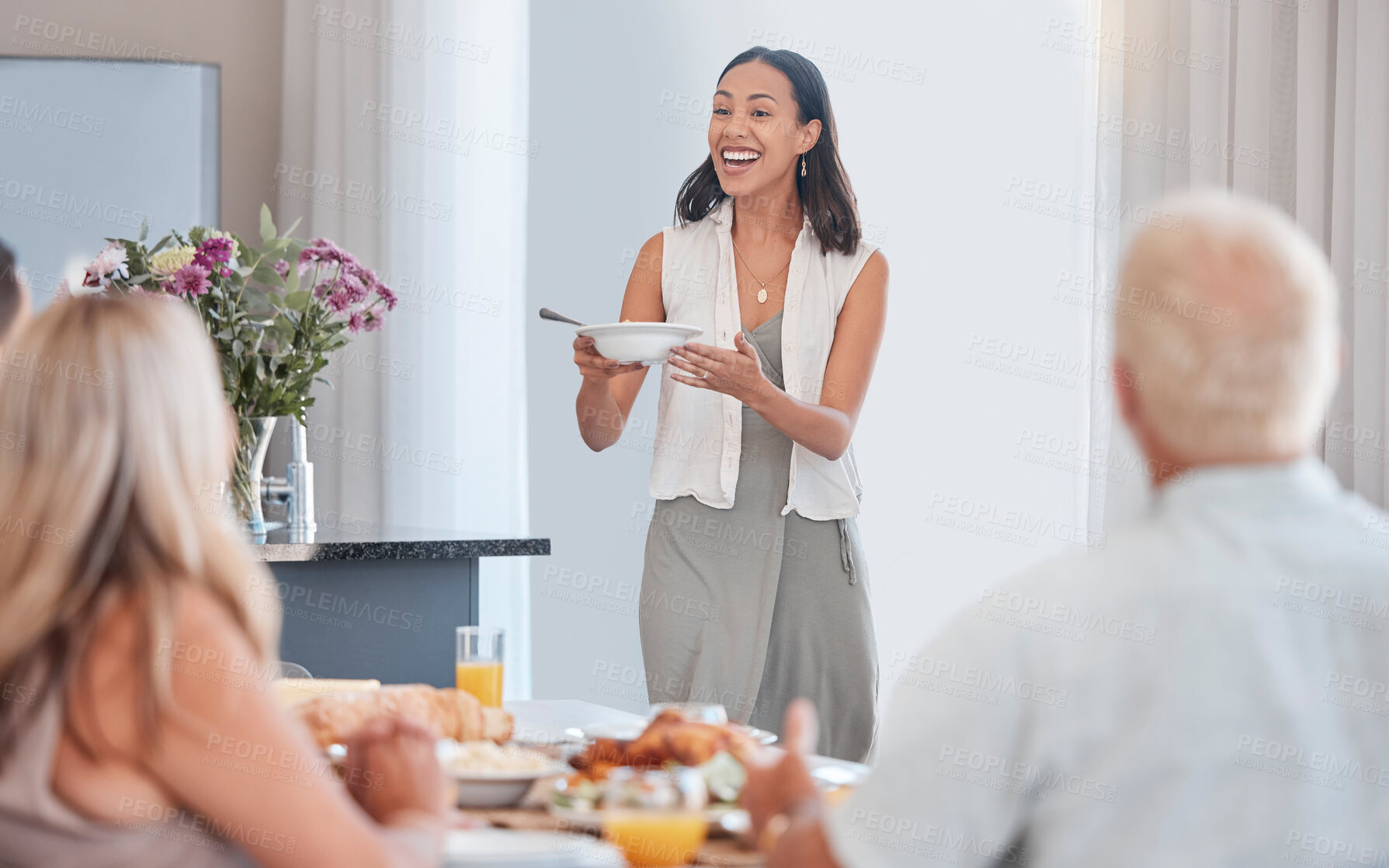 Buy stock photo Woman, excited and serving family at thanksgiving dining table in house or home for celebration event, holiday or buffet party. Smile, happy or festive person with healthy food, meal or brunch bowl