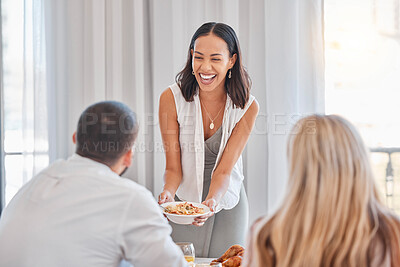 Buy stock photo Home, food and happy hosting woman serving guests lunch in Mexico home with cheerful smile. Happiness, wellness and girl hostess holding health couscous salad at friends house gathering.

