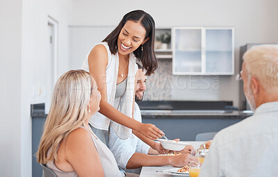 Buy stock photo Big family, breakfast and food with a woman cooking for parents in her home kitchen for health and wellness. Happy women and men together in Brazil house to share a meal and be happy together