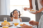 Hungry family, lunch food and child with hands of woman giving meal plate to youth kid at family reunion event. Love, happiness and young girl waiting for brunch buffet during quality bonding time