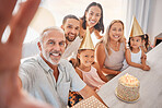 Birthday selfie, portrait family and cake with grandparents, children and parents in living room in house. Girl kids, mother, father and senior people taking photo at birthday party in family home