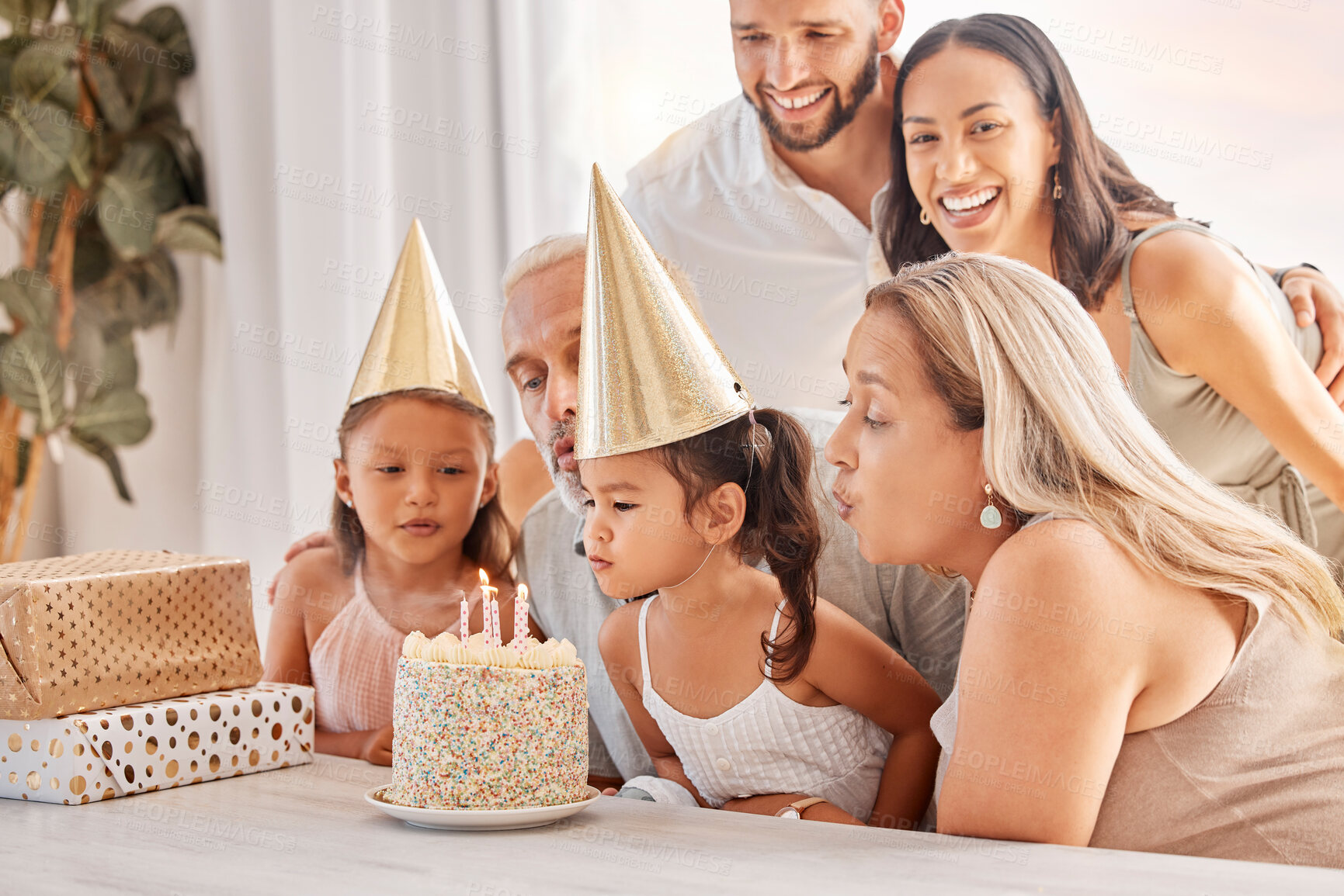 Buy stock photo Family, kids and birthday cake with a child and her big family celebrating with a party for fun event. Generations, mother and father with grandparents and grandkids celebrate with dessert or candles