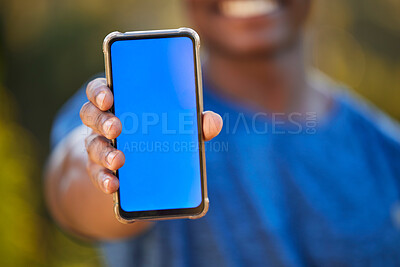 Buy stock photo Phone, mockup and blue screen in the hand of a black man outdoor for exercise or fitness tracking. Marketing, advertising and green screen with a male athlete holding mobile display to show an app