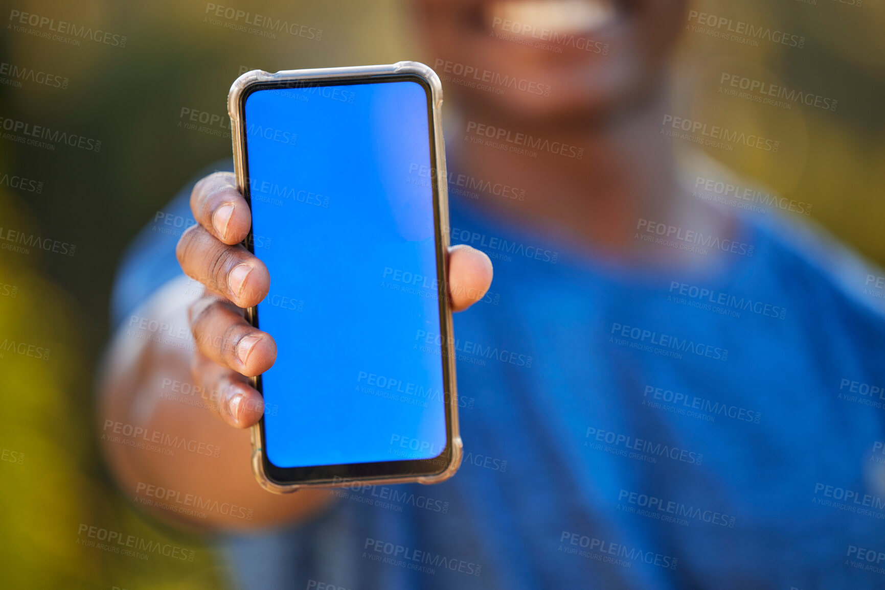 Buy stock photo Phone, mockup and blue screen in the hand of a black man outdoor for exercise or fitness tracking. Marketing, advertising and green screen with a male athlete holding mobile display to show an app