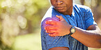 Hand, shoulder and pain with a sports black man holding his joint after injury during his fitness or exercise. Health, medical and anatomy with a male athlete suffering damage highlighted by CGI