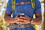 Hiking, hands and phone of backpacker browsing 5g gps directions in nature for fitness and exercise adventure. Cellphone, hiker and freedom online for backpacking explore in a natural environment