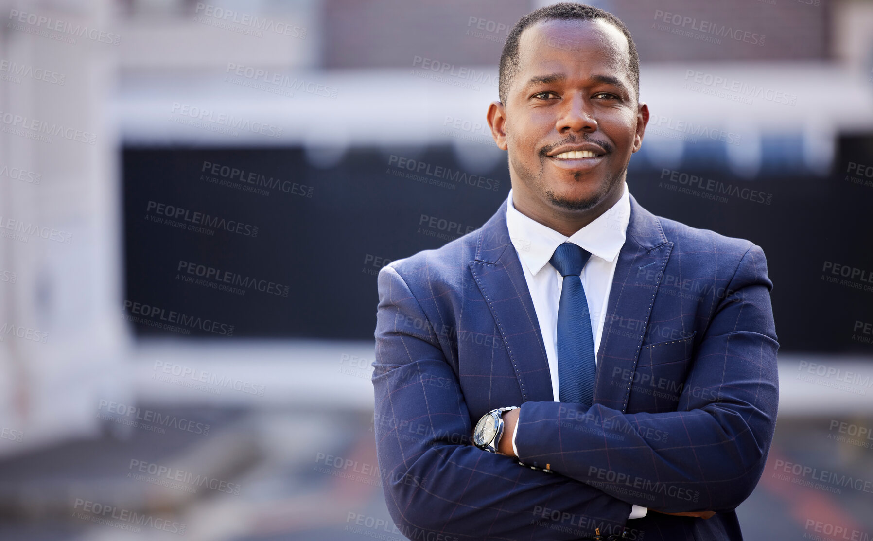 Buy stock photo Corporate, black man and smile in portrait with arms crossed in city, town or metro in government. African politician, happy and vision with motivation, professional confidence or leadership in suit