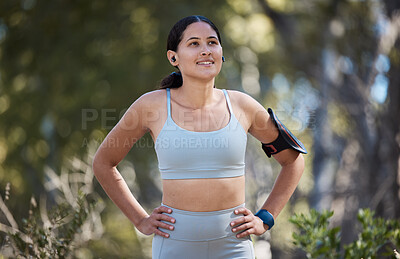 Buy stock photo Woman, earphones and fitness arm band in nature park break, garden or sustainability environment for exercise, training or workout. Smile, happy or resting runner listening to music or health podcast