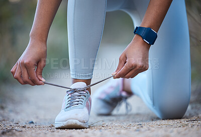 Buy stock photo Fitness, exercise and woman tie shoe after running, workout and marathon training in nature. Sports, wellness and closeup of hands tying lace on sneakers for performance, run and exercising outdoors