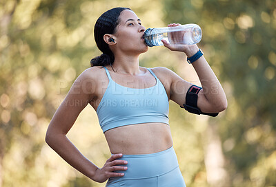 Buy stock photo Woman, fitness and drinking water for wellness, health and hydration outdoor in park with bottle. Runner, rest and water in nature for exercise, running or workout in summer sunshine in Los Angeles