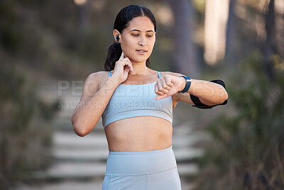 Buy stock photo Fitness, exercise and woman with smartwatch to check pulse, progress and performance while outdoor for running and cardio training. Female with watch for time on sports app during training in nature