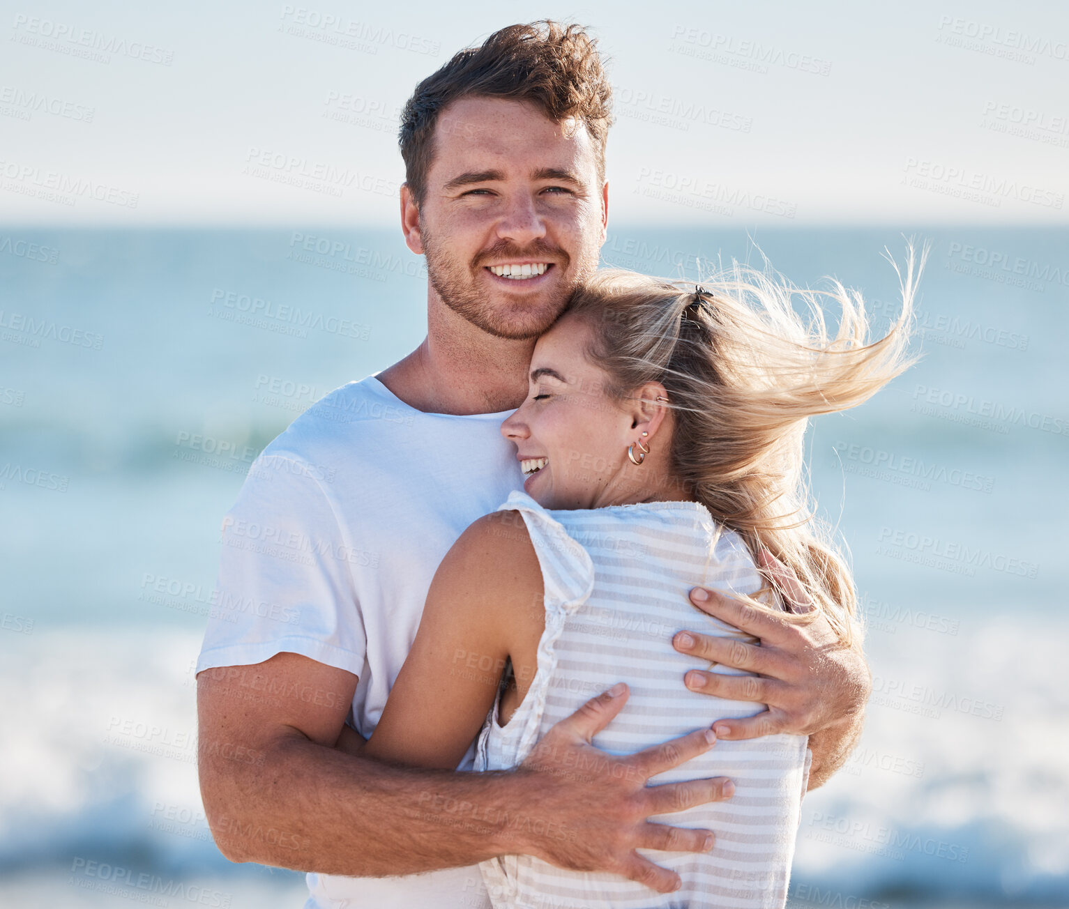 Buy stock photo Couple, hug and beach in summer while on vacation for love, care and support in a healthy marriage with happiness and trust. Portrait of a man and woman together by the sea for bonding and to relax