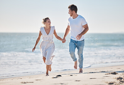 Buy stock photo Couple, beach and love for walk, romance and love in relationship bonding, care and quality time. Man, woman and happy by sea, ocean and sand together with happiness, holding hands and outdoor in sun