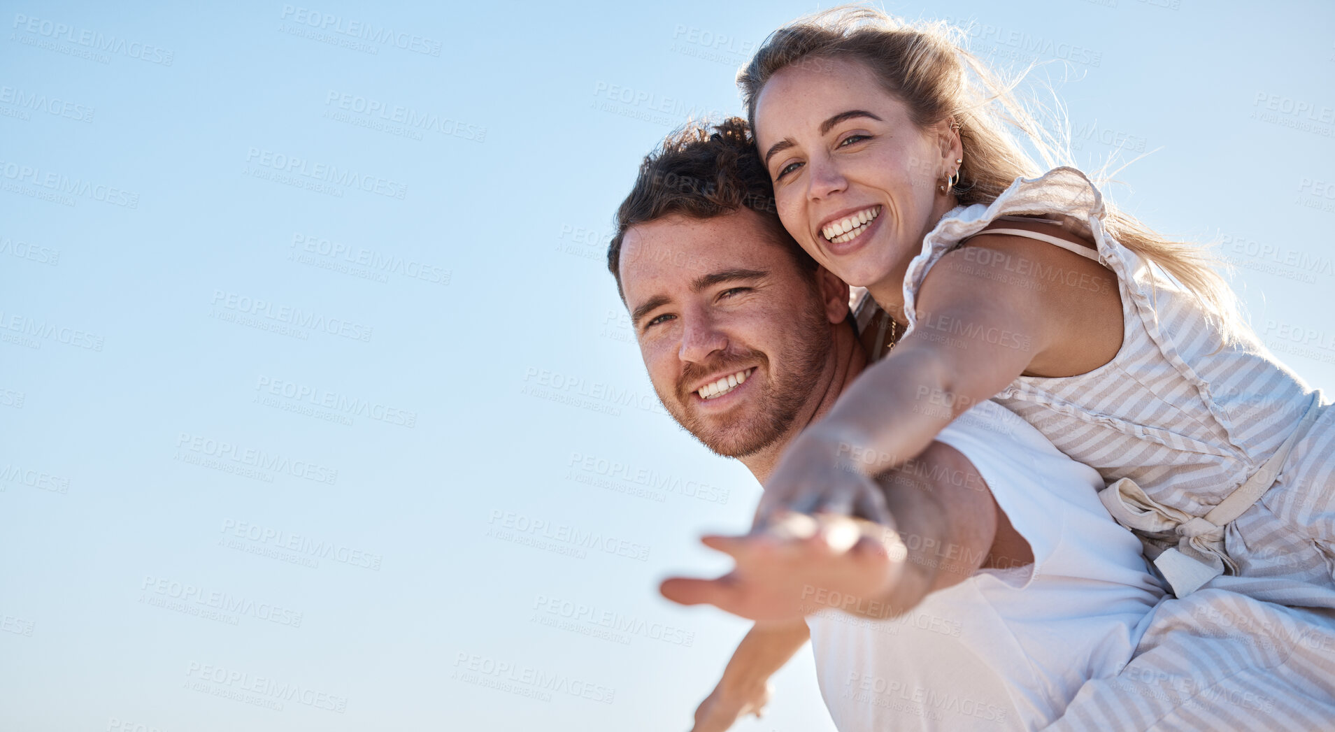 Buy stock photo Love, blue sky and happy couple together for summer, holiday and outdoor wellness, date anniversary and freedom with mockup. Happy woman and man piggyback ride for support, care and healthy lifestyle