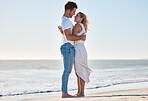 Hug, beach and happy couple on a romantic vacation for love together by the ocean in Australia. Travel, romance and young man and woman embracing while on a seaside honeymoon holiday or adventure.