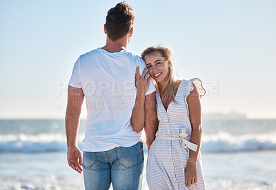 Buy stock photo Couple, love and beach sunset at the ocean while travel, bond and relax in nature together, happy and smile. Portrait, woman and rear view of man embrace, care and enjoy trip to Florida on blue sky