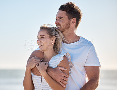 Buy stock photo Happy couple, love and beach vacation in summer with a hug, care and support while thinking about future and marriage. Man and woman outdoor by the ocean for fresh air, travel and holiday in nature