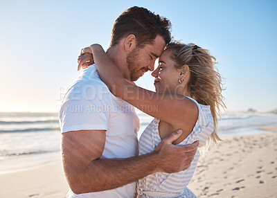 Buy stock photo Couple, love or bonding hug on beach by ocean, sea or Bali water waves in trust, security or support. Smile, happy or forehead touch man and woman on nature summer holiday in tropical travel location