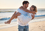 Couple, beach and man carrying woman for love, relax and marriage support together on travel adventure or vacation. Freedom, trust and happy man at Hawaii ocean outdoor for quality time in sunshine