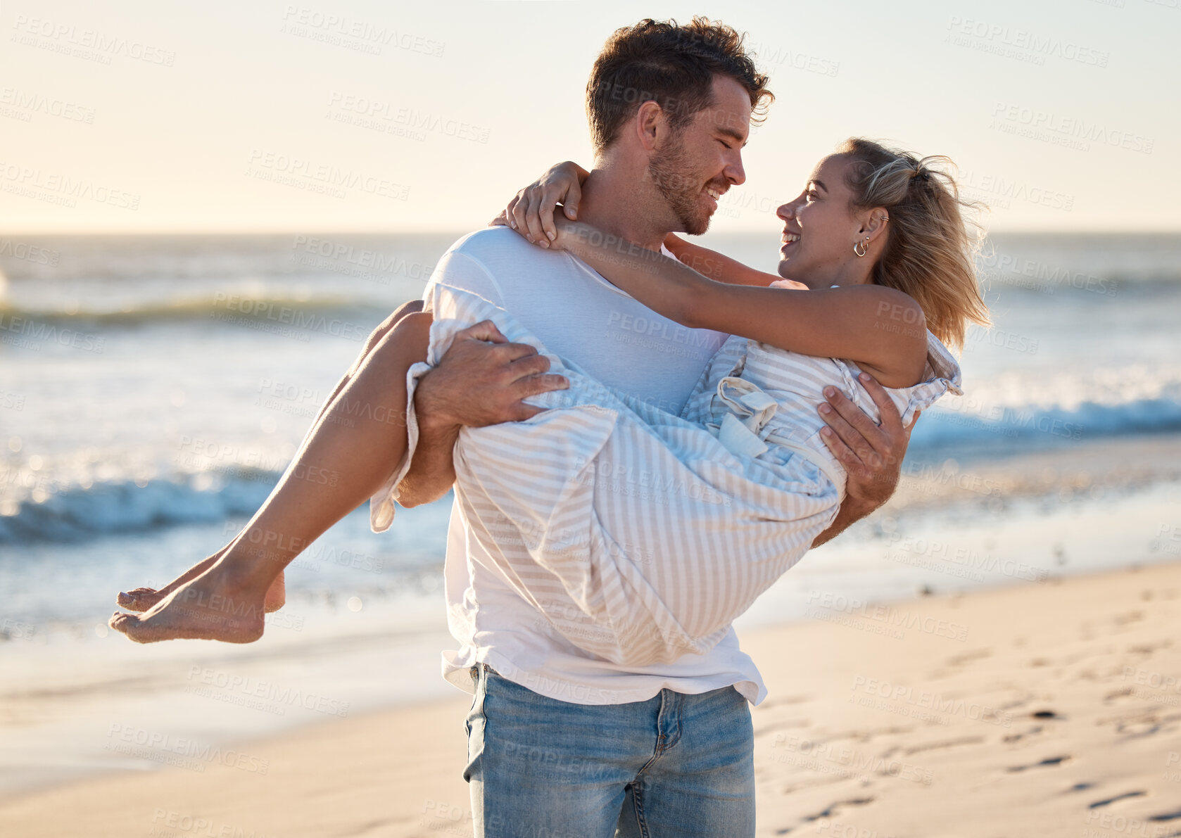 Buy stock photo Couple, beach and man carrying woman for love, relax and marriage support together on travel adventure or vacation. Freedom, trust and happy man at Hawaii ocean outdoor for quality time in sunshine