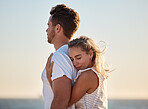 Couple, hug back and woman at beach with love, smile or happiness for anniversary, honeymoon or vacation by sea. Happy couple, man and girl in ocean wind, happy or bonding together in summer sunset