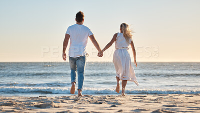 Buy stock photo Couple, hand holding and vacation at beach, love and trust together with travel and adventure with nature and ocean view. Man, woman bonding and back view, support with sea, sand and romantic holiday