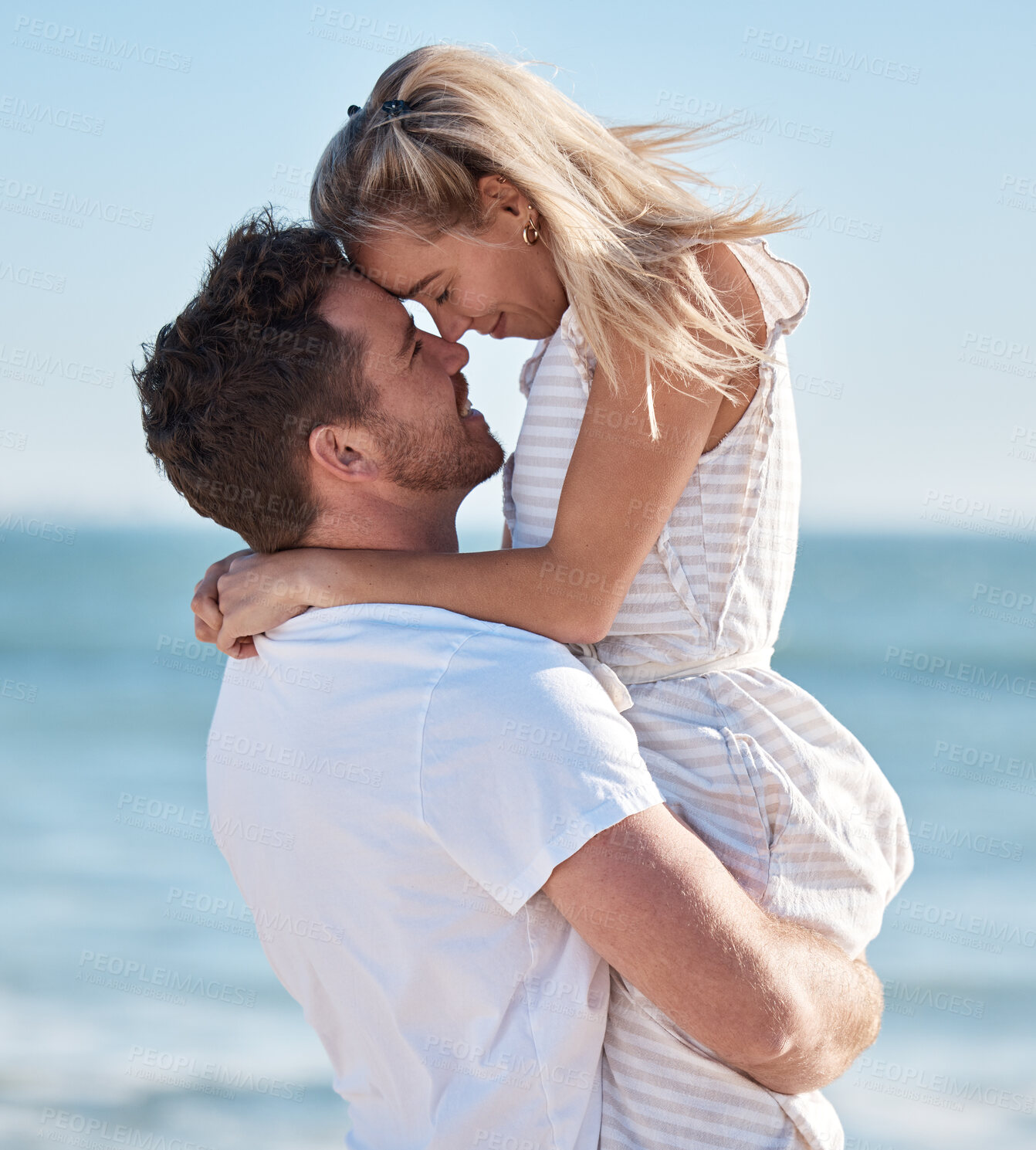 Buy stock photo Beach, couple and hug, lifting and love, care and romantic date, summer vacation and sunshine holiday. Happy couple, man and woman at ocean, freedom and travel, honeymoon resort and tropical sea fun 