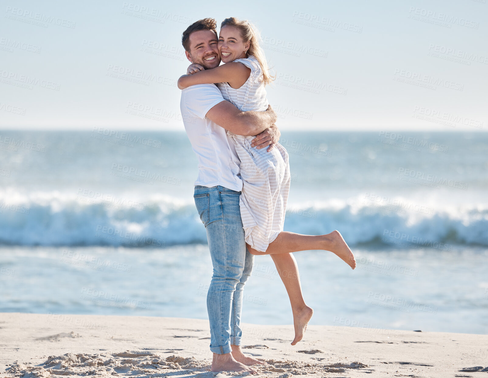 Buy stock photo Hug, happy and couple at the beach for love, peace and relax on a tropical holiday in Hawaii. Freedom, travel and portrait of a man and woman hugging by the ocean excited about a vacation in summer