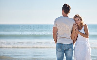 Buy stock photo Love, peace and couple at a beach to relax on holiday, vacation or weekend in a summer romance together. Travel, freedom and happy woman enjoys hugging her partner with affection in nature or ocean