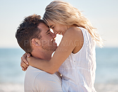 Buy stock photo Beach, love and couple nose touch with smile for romance, bond and happiness with carrying hug. Partner, holiday and Canada ocean embrace in summer for happy, relaxing and intimate memory.

