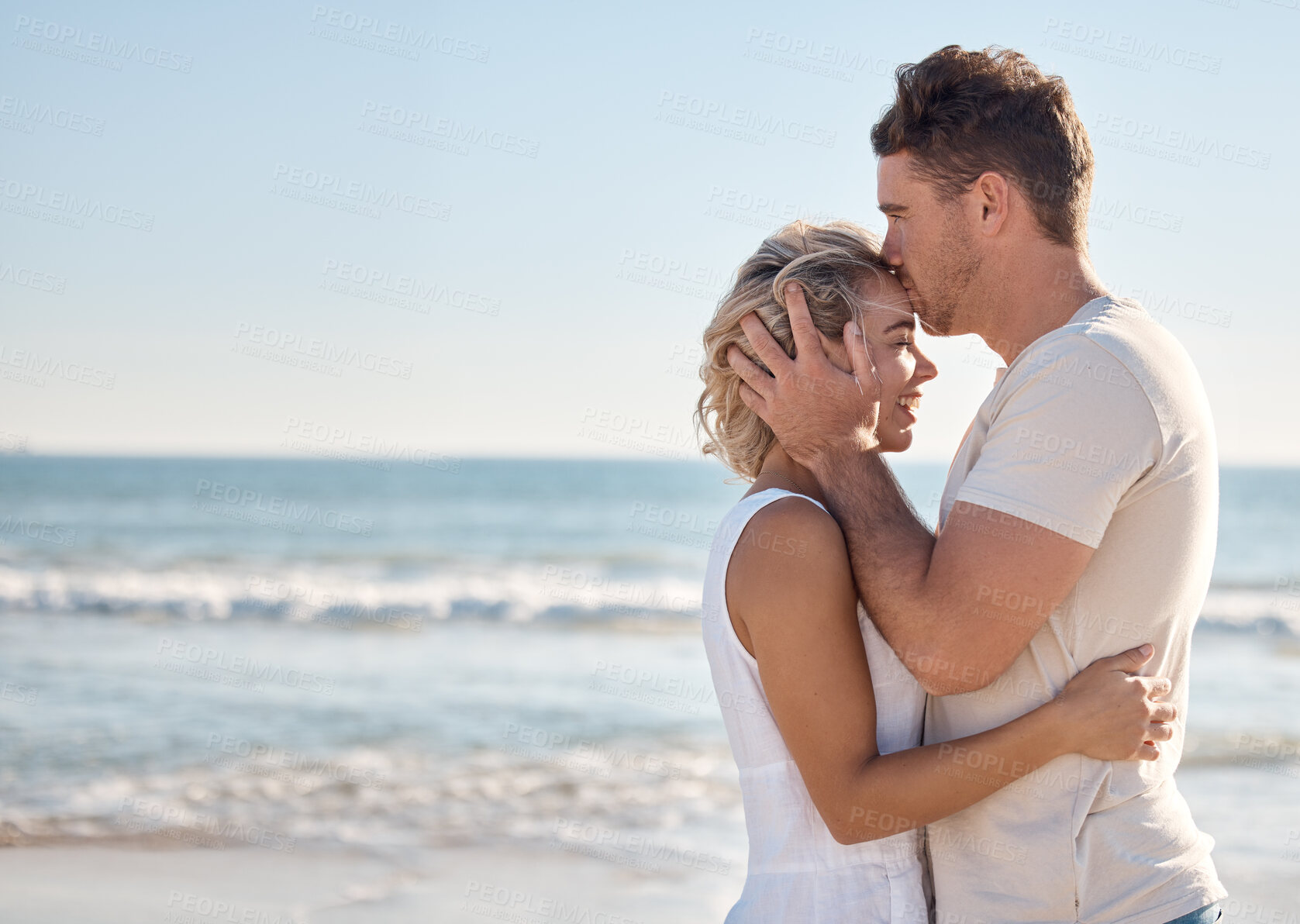 Buy stock photo Beach hug, love and couple kiss forehead on romantic Sydney Australia mockup, bonding vacation or holiday freedom. Ocean peace, mock up blue sky and marriage partnership of man and woman on honeymoon