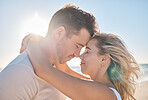 Beach hug, couple love and forehead touching of husband and wife on honeymoon vacation in Toronto Canada. Blue sky flare, freedom peace and marriage partnership bond of man and woman on romantic date
