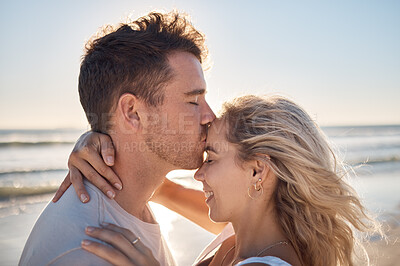 Buy stock photo Love, dating and couple kiss at beach enjoying romantic holiday, vacation and honeymoon by ocean. Happiness, summer and young man and woman embrace, show affection and bonding together in nature