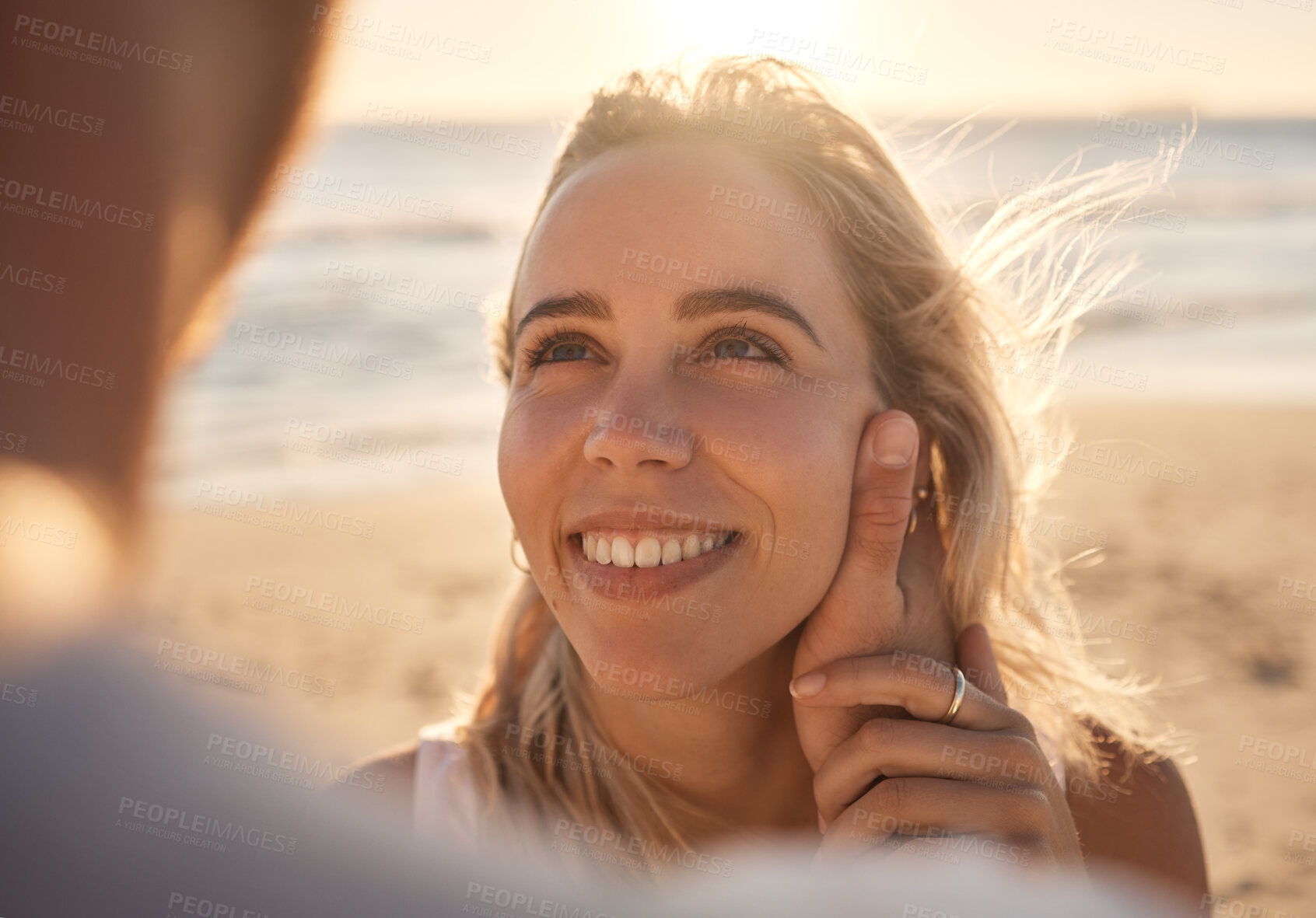 Buy stock photo Affection, love and couple at the beach for a date, honeymoon and quality time by the sea. Travel, relax and face of a woman with an embrace from a man while on holiday by the ocean to relax